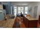 Bright and airy kitchen featuring granite countertops, stainless steel sink, and a sunlit breakfast nook at 480 Meadow Sage Ln, Fayetteville, GA 30214