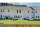 Townhome features a well-manicured backyard with a wooden fence at 8708 Lakeview Commons # 47, Jonesboro, GA 30238