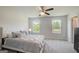 Bedroom with carpet, ceiling fan, and windows for natural light at 8708 Lakeview Commons # 47, Jonesboro, GA 30238