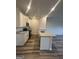 Modern kitchen featuring white cabinets, granite countertops, and new appliances at 8726 Lakeview Commons # 50, Jonesboro, GA 30238