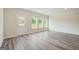Bright living room with new gray vinyl flooring and abundant natural light at 8726 Lakeview Commons # 50, Jonesboro, GA 30238