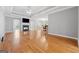 Open-concept living area with hardwood floors, fireplace, recessed lighting, and access to the kitchen at 1570 Woodberry Run Dr, Snellville, GA 30078