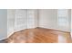 Bright bedroom featuring hardwood floors, neutral paint, large windows, and bay window at 4875 Ben Hill Rd, College Park, GA 30349
