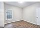 Bedroom features one window, neutral walls, and flooring at 4875 Ben Hill Rd, College Park, GA 30349