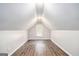 Spacious bonus room with hardwood floors, a window for natural light, and neutral paint at 4875 Ben Hill Rd, College Park, GA 30349