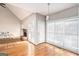 Living room showcasing hardwood floors, natural light, and brick fireplace in an open layout at 4875 Ben Hill Rd, College Park, GA 30349
