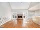 Living room boasting hardwood floors, brick fireplace, neutral paint, and vaulted ceiling at 4875 Ben Hill Rd, College Park, GA 30349