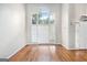 Inviting living room featuring hardwood floors, neutral paint, and a statement arched window at 4875 Ben Hill Rd, College Park, GA 30349