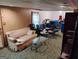 Spacious basement with carpet, sofa, and assorted chairs at 6501 River Run Rd, Riverdale, GA 30274