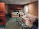 Basement den featuring fireplace and carpet at 6501 River Run Rd, Riverdale, GA 30274