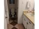 Quaint bathroom featuring a vintage-style sink area and a view of the toilet at 6501 River Run Rd, Riverdale, GA 30274