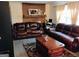 Comfortable living room with fireplace and plush leather sofas at 6501 River Run Rd, Riverdale, GA 30274
