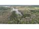 Scenic aerial view of wooded acreage with lake access at 655 Sunset Dr, Locust Grove, GA 30248