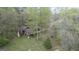 An aerial view of the home featuring surrounding mature trees at 655 Sunset Dr, Locust Grove, GA 30248