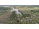 Scenic aerial view of wooded acreage with lake access at 655 Sunset Dr, Locust Grove, GA 30248