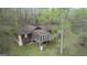 Aerial view of house, surrounded by trees at 655 Sunset Dr, Locust Grove, GA 30248