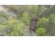 Aerial of secluded home surrounded by mature trees and waterfront at 655 Sunset Dr, Locust Grove, GA 30248