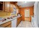 Efficient kitchen with wooden cabinets, double sink and lots of counter space at 655 Sunset Dr, Locust Grove, GA 30248