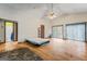 Open-concept living room with hardwood floors, fireplace and access to the bathroom at 655 Sunset Dr, Locust Grove, GA 30248