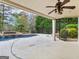 Scenic backyard featuring a pristine pool with a waterfall feature and lush landscaping at 5297 Heron Bay Blvd, Locust Grove, GA 30248