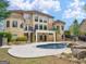 Beautiful backyard with inground pool, landscaping, and multi-level patio space at 5297 Heron Bay Blvd, Locust Grove, GA 30248