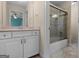 Bathroom featuring a vanity with drawers, stone tile floors, and glass door shower at 5297 Heron Bay Blvd, Locust Grove, GA 30248