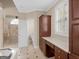 Elegant bathroom featuring a soaking tub, separate shower, and a vanity with ample storage at 5297 Heron Bay Blvd, Locust Grove, GA 30248