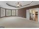 Bright bedroom with bay windows, tray ceilings, and easy access to the staircase at 5297 Heron Bay Blvd, Locust Grove, GA 30248
