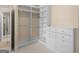 Well-organized walk-in closet featuring built-in shelving and drawers for efficient storage at 5297 Heron Bay Blvd, Locust Grove, GA 30248