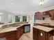 Bright kitchen with granite countertops, custom cabinets, and stainless steel appliances at 5297 Heron Bay Blvd, Locust Grove, GA 30248
