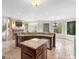 Beautiful kitchen with stainless appliances, island, and access to the back yard at 5297 Heron Bay Blvd, Locust Grove, GA 30248