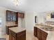 Custom kitchen with granite countertops, island, and stainless appliances at 5297 Heron Bay Blvd, Locust Grove, GA 30248