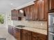 Custom kitchen with granite countertops, custom cabinets and stainless appliances at 5297 Heron Bay Blvd, Locust Grove, GA 30248