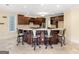 Large kitchen with island, granite counters, custom cabinets, and barstool seating at 5297 Heron Bay Blvd, Locust Grove, GA 30248