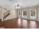 Bright open-plan living area with hardwood floors and backyard access at 5297 Heron Bay Blvd, Locust Grove, GA 30248