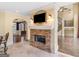 Elegant living room with stone fireplace, TV, and access to other parts of the house at 5297 Heron Bay Blvd, Locust Grove, GA 30248