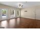 Hardwood floor living room with neutral walls, backyard views and natural light at 5297 Heron Bay Blvd, Locust Grove, GA 30248