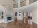 Spacious living room featuring a fireplace, hardwood floors, and a soaring ceiling at 5297 Heron Bay Blvd, Locust Grove, GA 30248