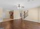 Hardwood floors in a large open-concept living room with a partial kitchen at 5297 Heron Bay Blvd, Locust Grove, GA 30248