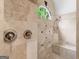 Detailed shower with decorative tile work and a window letting in light to a built-in shower bench at 5297 Heron Bay Blvd, Locust Grove, GA 30248