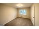 Cozy bedroom with plush carpet and ample natural light filtering through the window at 2942 Elkhorn Ct, Decatur, GA 30034