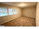 Simple bedroom featuring plush carpeting and two windows for ample natural light at 2942 Elkhorn Ct, Decatur, GA 30034