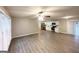 Spacious open-concept living room with hardwood floors that flows into a modern kitchen at 2942 Elkhorn Ct, Decatur, GA 30034