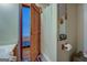 Well-lit bathroom featuring a white shower curtain and a door that allows access to the bedroom at 3011 Broughton Rd, Newborn, GA 30056