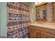 Charming bathroom showcasing a double vanity with mosaic tile backsplash and a unique decorative shower curtain at 3011 Broughton Rd, Newborn, GA 30056