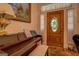 Inviting foyer features piano, stained glass door, and hardwood floor at 3011 Broughton Rd, Newborn, GA 30056