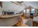 A spacious kitchen features tile countertops, wood floors, and a view to the rest of the home at 3011 Broughton Rd, Newborn, GA 30056