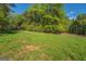 Grassy area in wooded area provides a natural setting for development and recreation at 3011 Broughton Rd, Newborn, GA 30056