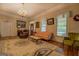 Comfortable living room with vintage decor, including a chandelier and area rug at 3011 Broughton Rd, Newborn, GA 30056