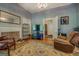 Living room featuring a fireplace, vintage rug, and plenty of room for entertaining at 3011 Broughton Rd, Newborn, GA 30056